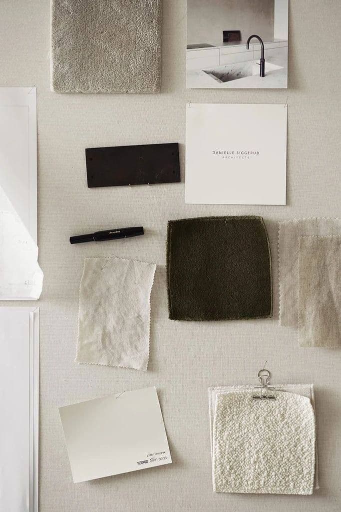 Material moodboard with fabric swatches and colour chips